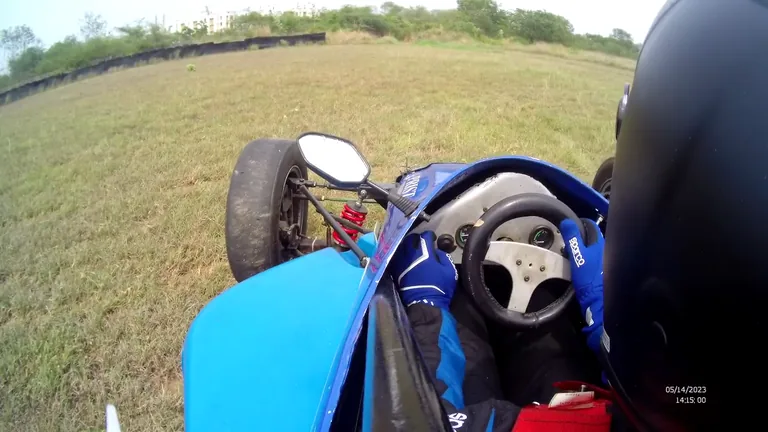 The car travelling across grass at 11 minutes 24 seconds