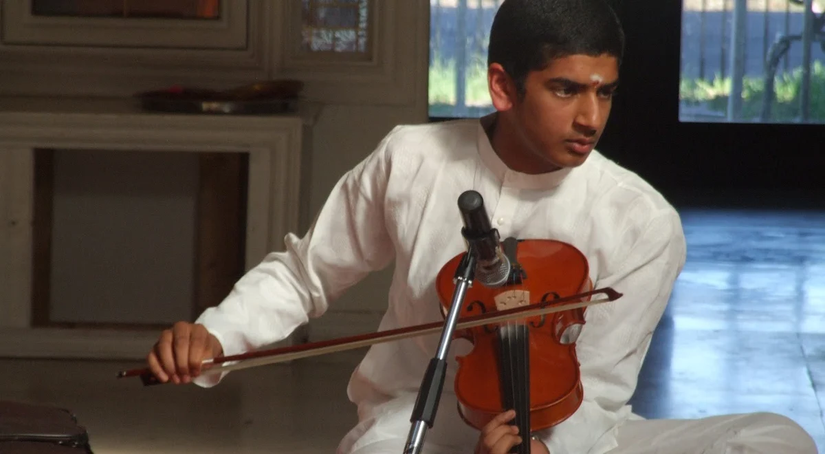 Seated Carnatic violin performance