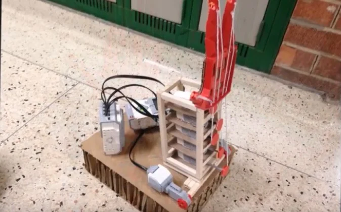An early hand-prosthesis prototype with visible wiring and actuators